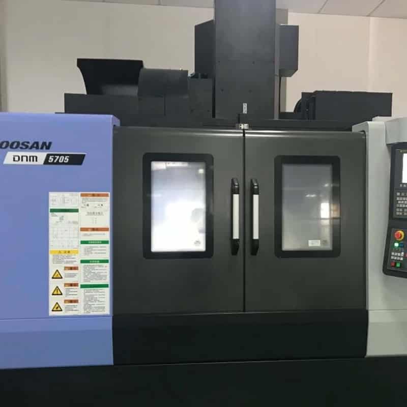 CNC milling machine producing precision parts